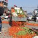 Dissenting farmers throw agro produce in the road