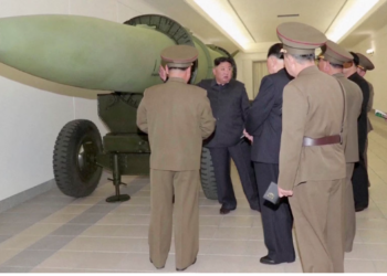 North Korea unveils new nuclear warheads as US air carrier arrives in South