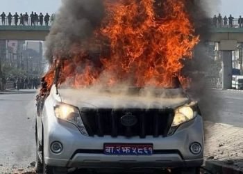 Protesting youths torch vehicle used by minister Jwala in Balkumari