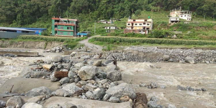 Flood-fed Melamchi sweeps away a temporary bridge