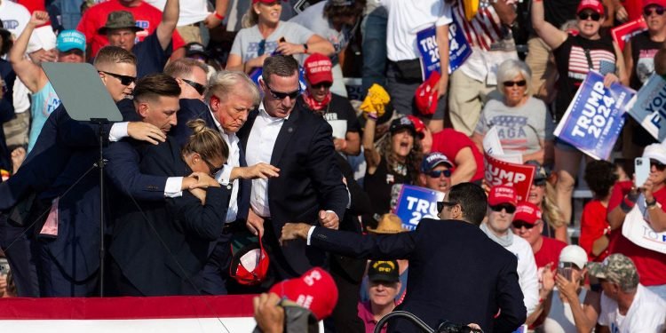 Bloodied Trump survives assassination attempt