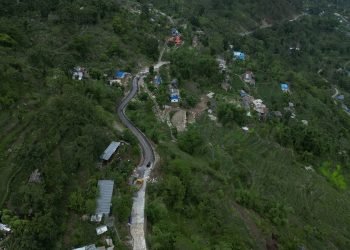 Road blacktopped long after opening of track