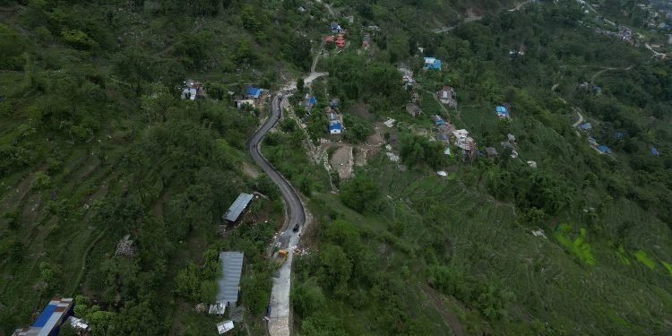 Road blacktopped long after opening of track