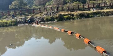 Trash barrier installed to capture floating waste in Bagmati River