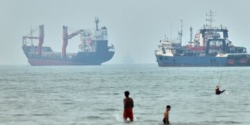 Cargo ship reports being struck in Strait of Hormuz as US, Iran claims about talks diverge
