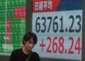 Global shares trade mostly lower after AI stocks sink on Wall Street