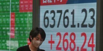 Global shares trade mostly lower after AI stocks sink on Wall Street