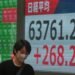 Global shares trade mostly lower after AI stocks sink on Wall Street
